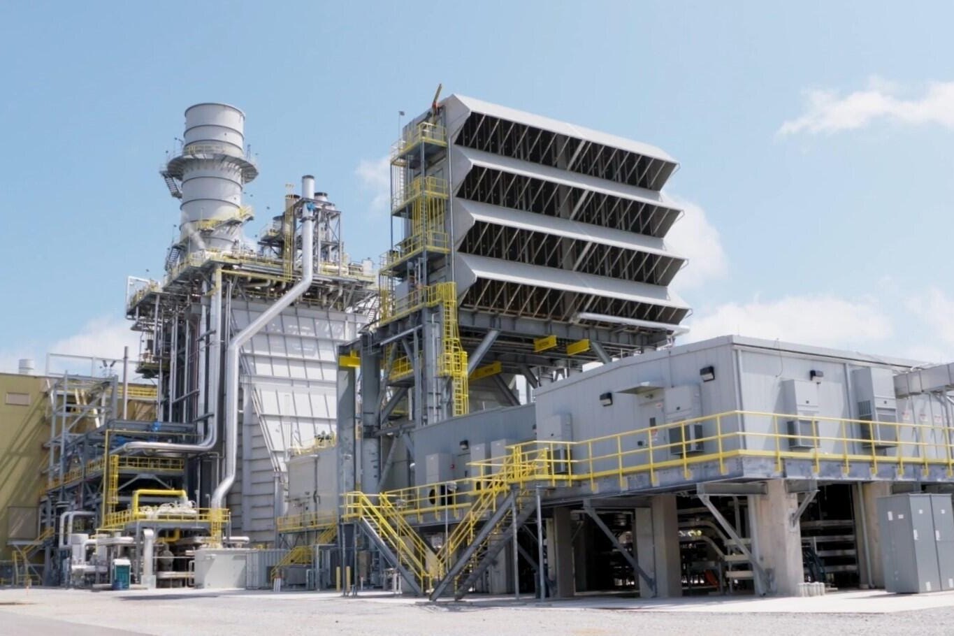 Combined-cycle power plant at sunset